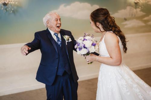 The best wedding photography captures the memorable moment of a bride alongside an old man in a wedding dress in 2023.