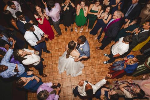 A captivating moment captured by a wedding photographer, showcasing the newlywed couple gracefully dancing on the dance floor during their memorable 2023 wedding reception.