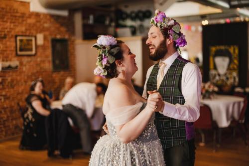 A Western MA Wedding Photographer captures the joyful sight of a bride and groom dancing at a wedding reception.