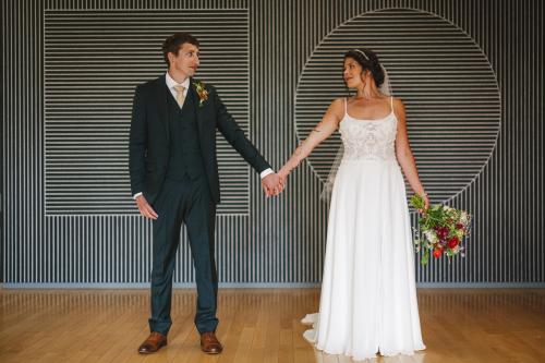 A Western MA Wedding Photographer captures the intimate moment of a man and woman holding hands.