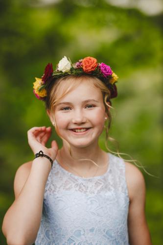 A little girl wearing a flower crown captured by a Western MA Wedding Photographer.