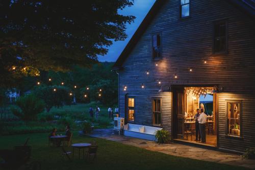 Capture exquisite wedding photography at an enchanting barn adorned with elegant string lights.