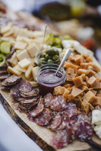 A platter of meats and cheeses on a table captured by a Western MA Wedding Photographer.